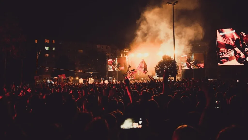 Image of concert at night with a large crowd