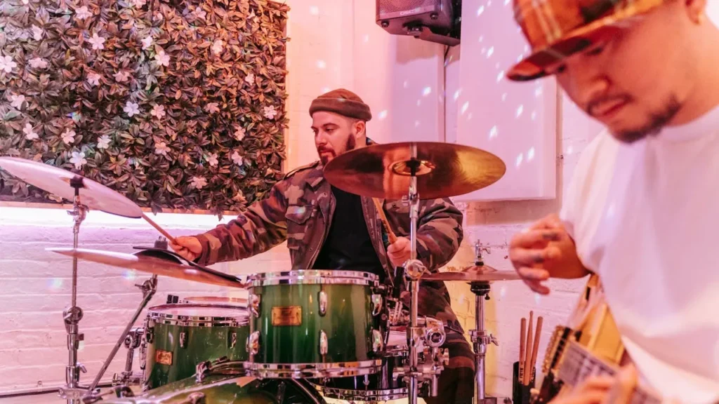 Image of drummer perfoming in fancy lighting