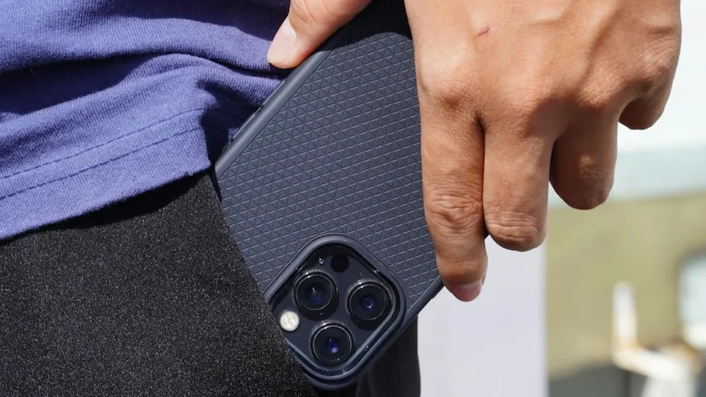 Image of man taking phone out of pocket