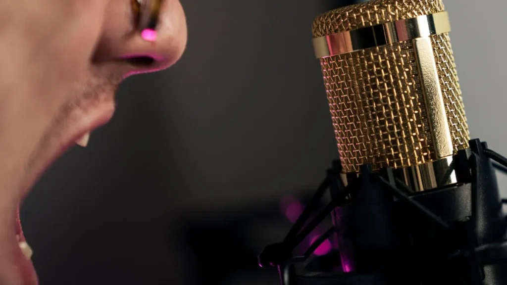 Image of a man shouting into a condenser microphone