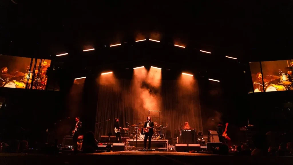 Image of a stage with a band on stage